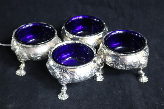 A set of four George II later embossed silver bun salts by David Hennell I, London, 1752, 8cm.
